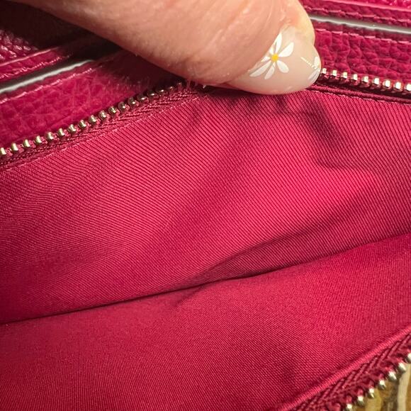 Coach Foldover Crossbody Clutch in the color Dark Fuchsia leather w/ charm NWT - Picture 11 of 13